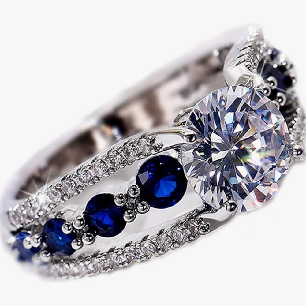 Silver and Blue Sapphire Ring with Intricate Design